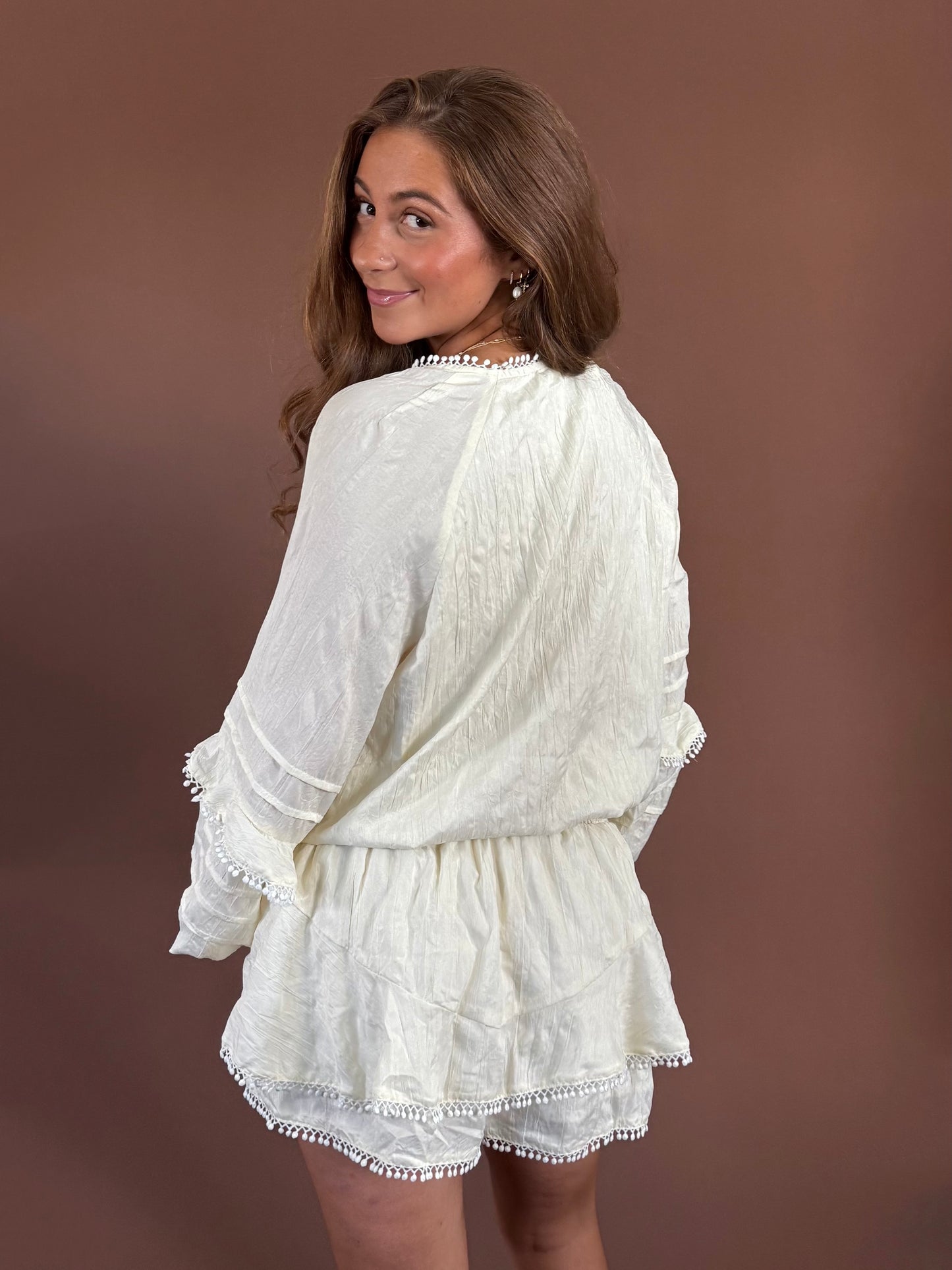 Aurora Long Sleeve Smocked Ruffle Romper in Ivory