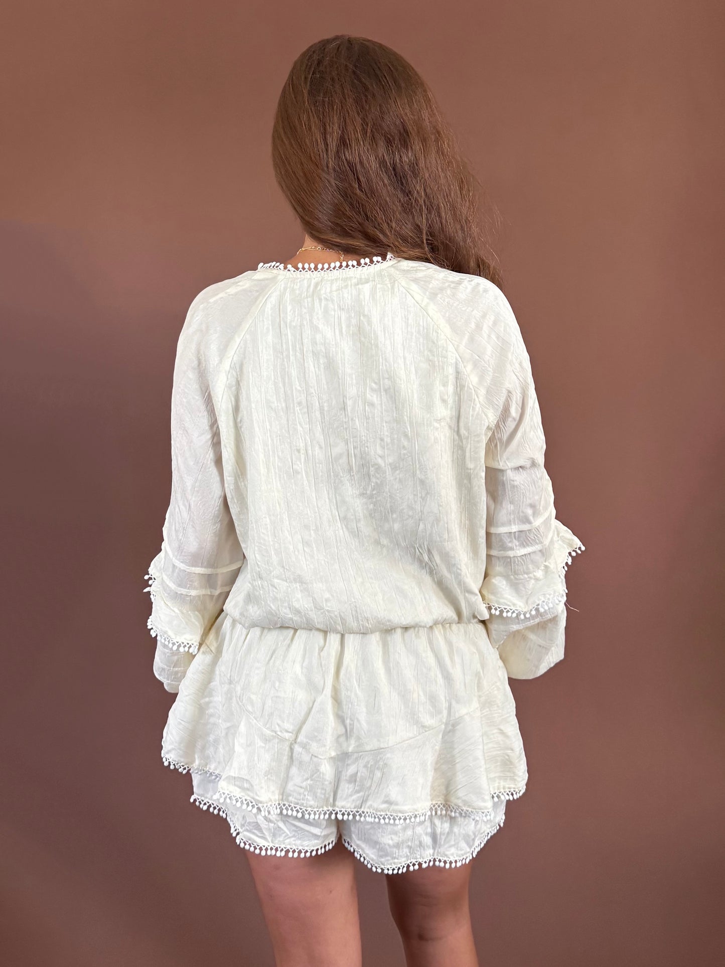 Aurora Long Sleeve Smocked Ruffle Romper in Ivory