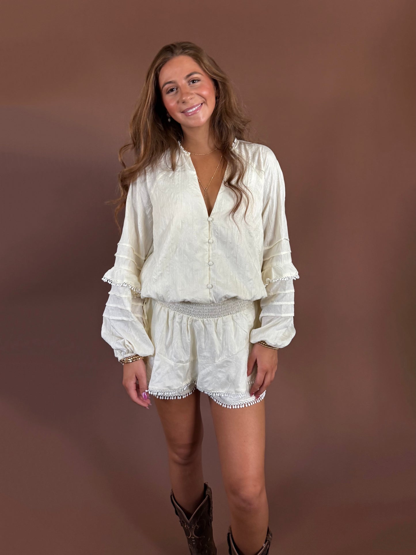 Aurora Long Sleeve Smocked Ruffle Romper in Ivory
