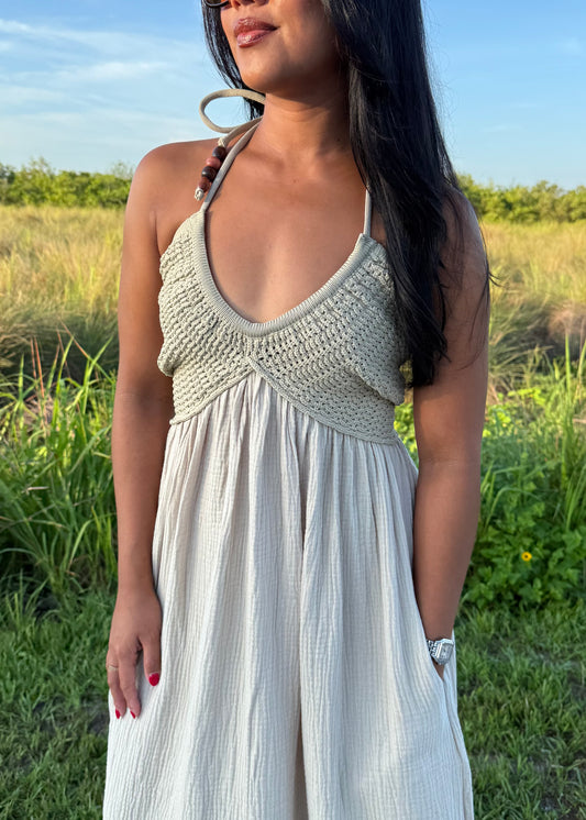 woman wearing a long maxi dress on a grass background