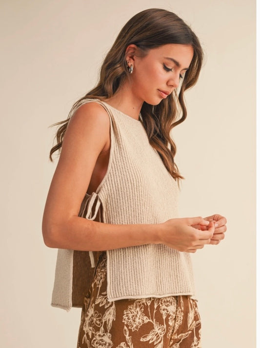 Rowan Sleeveless Sweater Top with open sides and self tie in a natural color