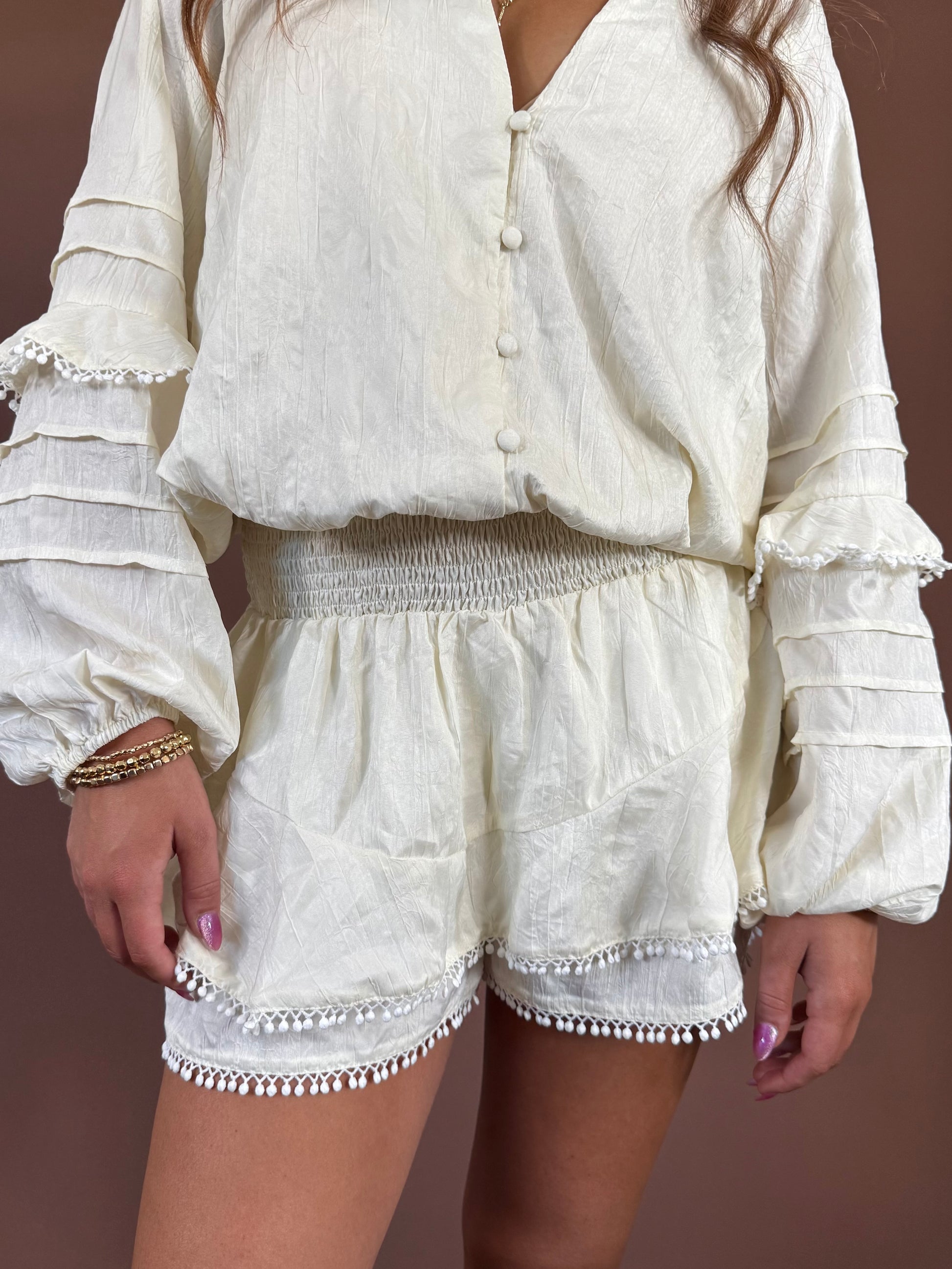 Aurora Long Sleeve Smocked Ruffle Romper in Ivory