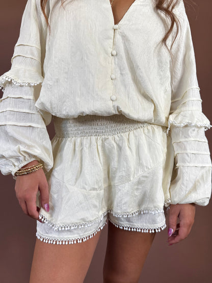 Aurora Long Sleeve Smocked Ruffle Romper in Ivory