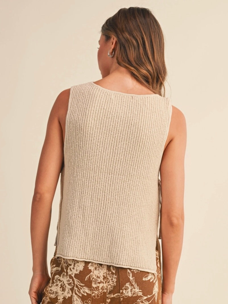 Rowan Sleeveless Sweater Top with open sides and self tie in a natural color