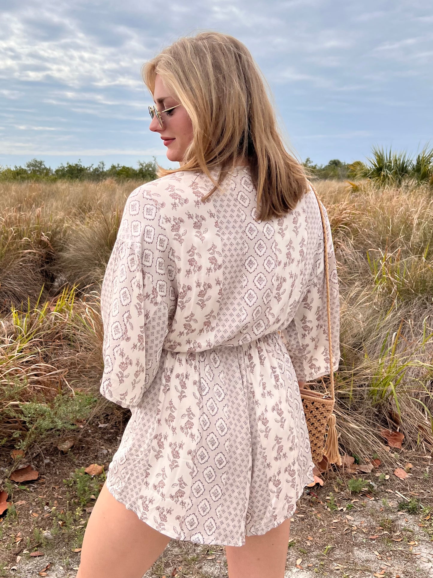 Kinsley Cream Printed Romper with tassel belt