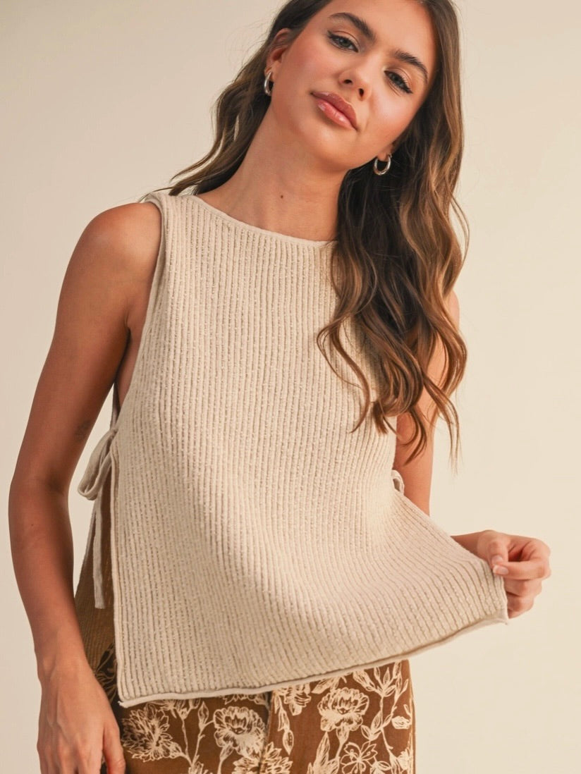 Rowan Sleeveless Sweater Top with open sides and self tie in a natural color