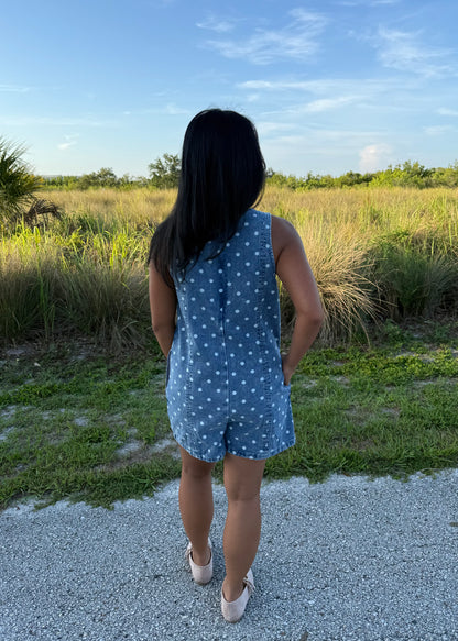 Girl wearing Millie Polka Dot Romper in Denim with grass background