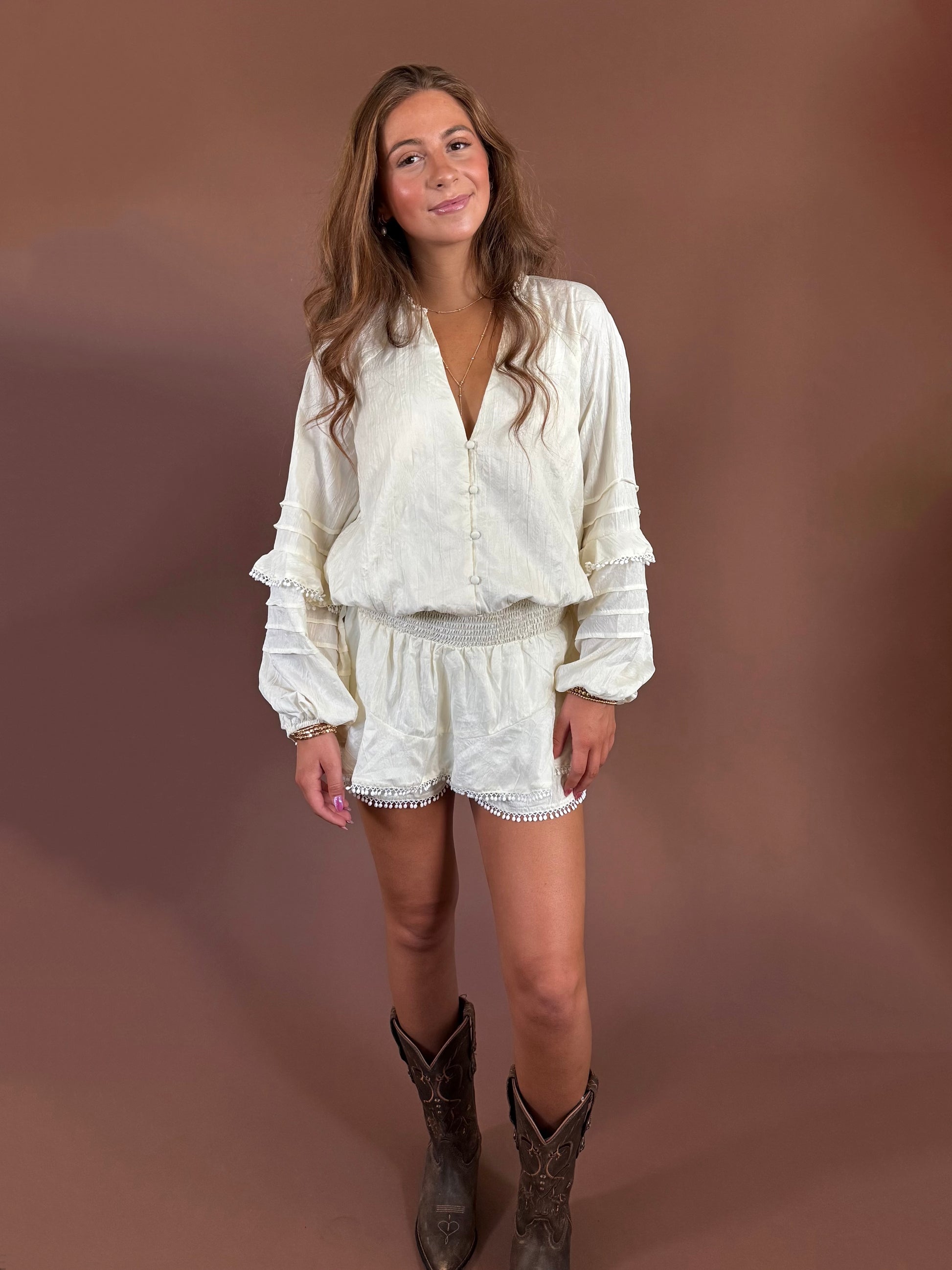 Aurora Long Sleeve Smocked Ruffle Romper in Ivory