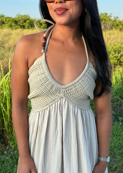 woman wearing a long maxi dress on a grass background