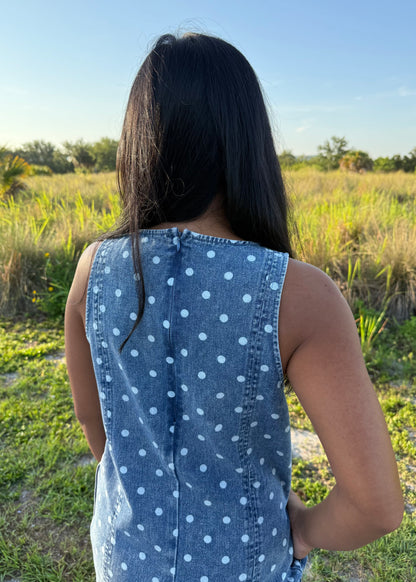 Girl wearing Millie Polka Dot Romper in Denim with grass background