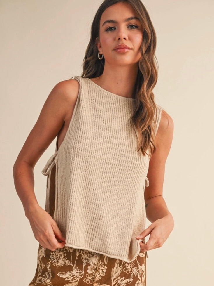 Rowan Sleeveless Sweater Top with open sides and self tie in a natural color