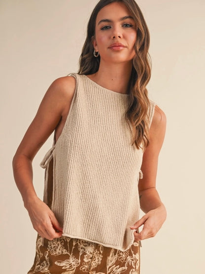 Rowan Sleeveless Sweater Top with open sides and self tie in a natural color