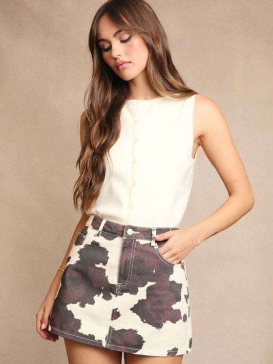 Carson Denim Mini Skirt in Cow Print & Annie Button Up Sleeveless Top in White