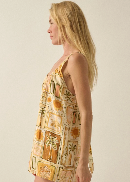Woman wearing a patterned dress against a plain background